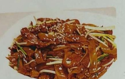 Gewokte rijststick met sojasaus